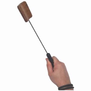Hand holding a Spoon for testicle and CBT play.